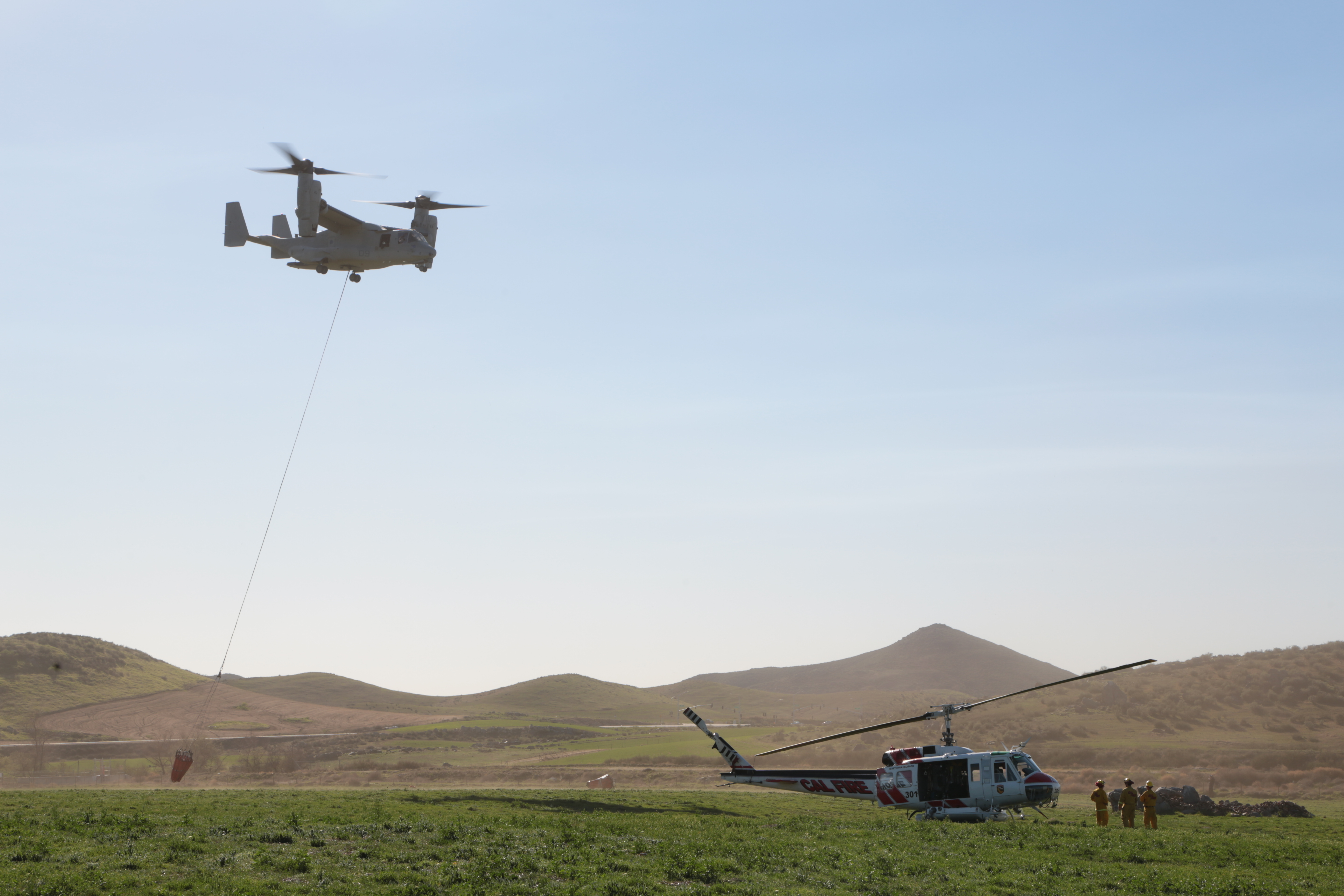 MV-22 Osprey drops water on simulated wildfire