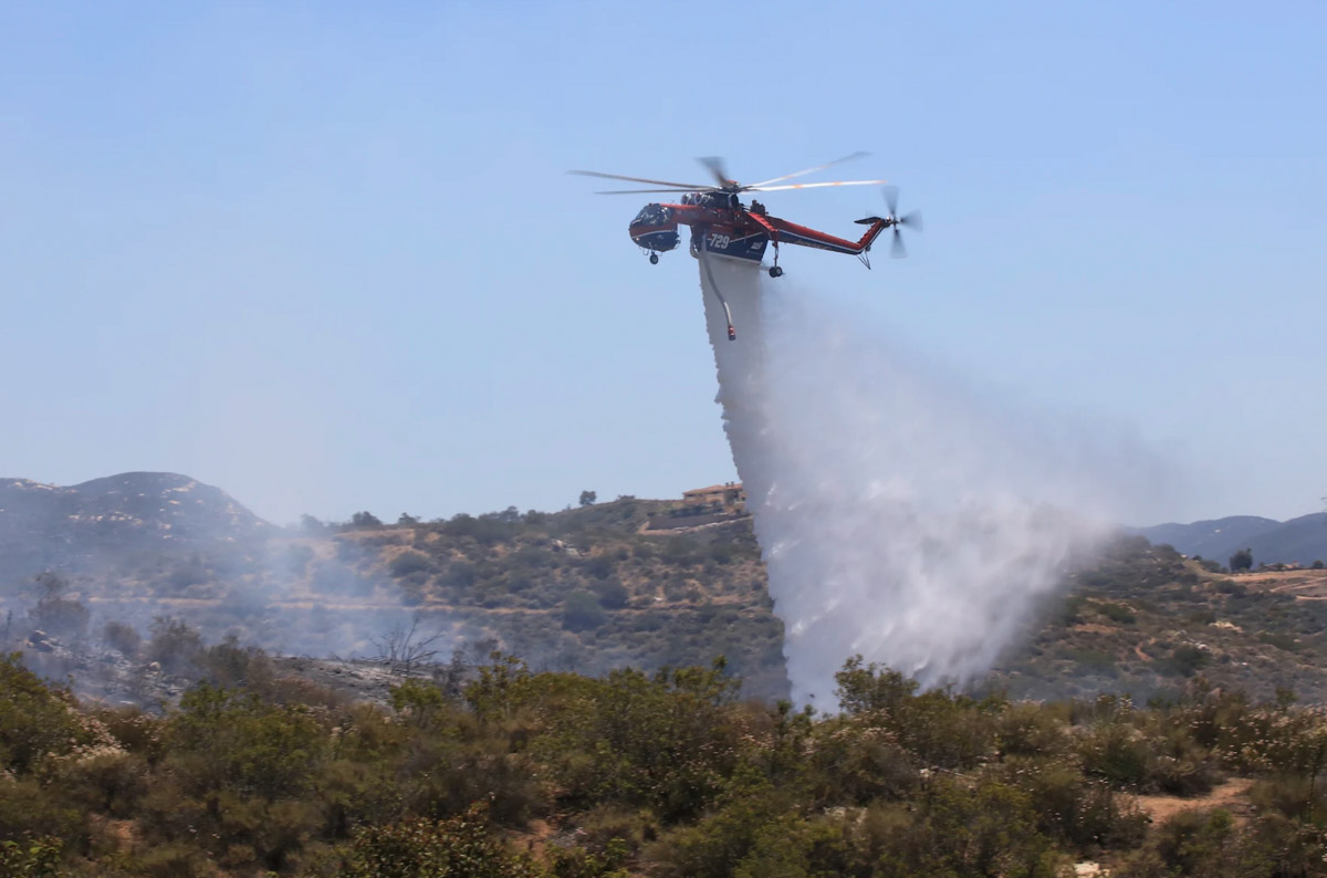 Helicopter 729 drops on a fire
