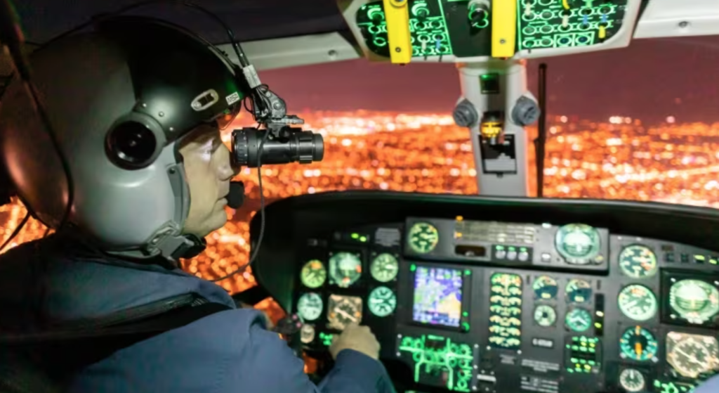 A pilot on a training flight. The NVG-equipped AS365  flew several Alberta fires in 2023. Talon photo