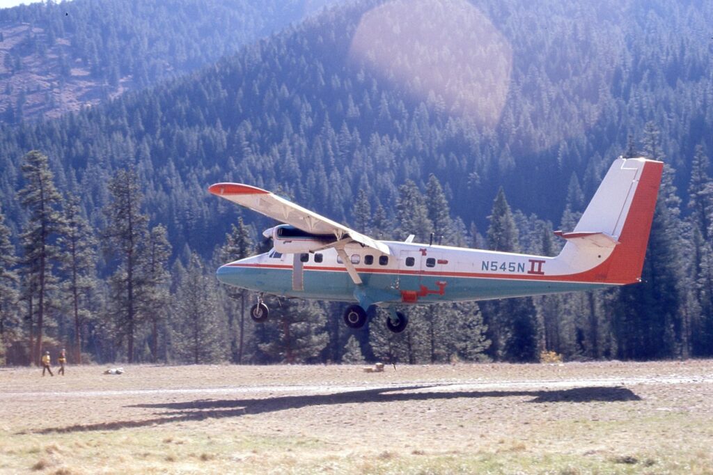 De Havilland Twin Otter landing at Indian Creek. Look at all the red tape around bottom of the door!